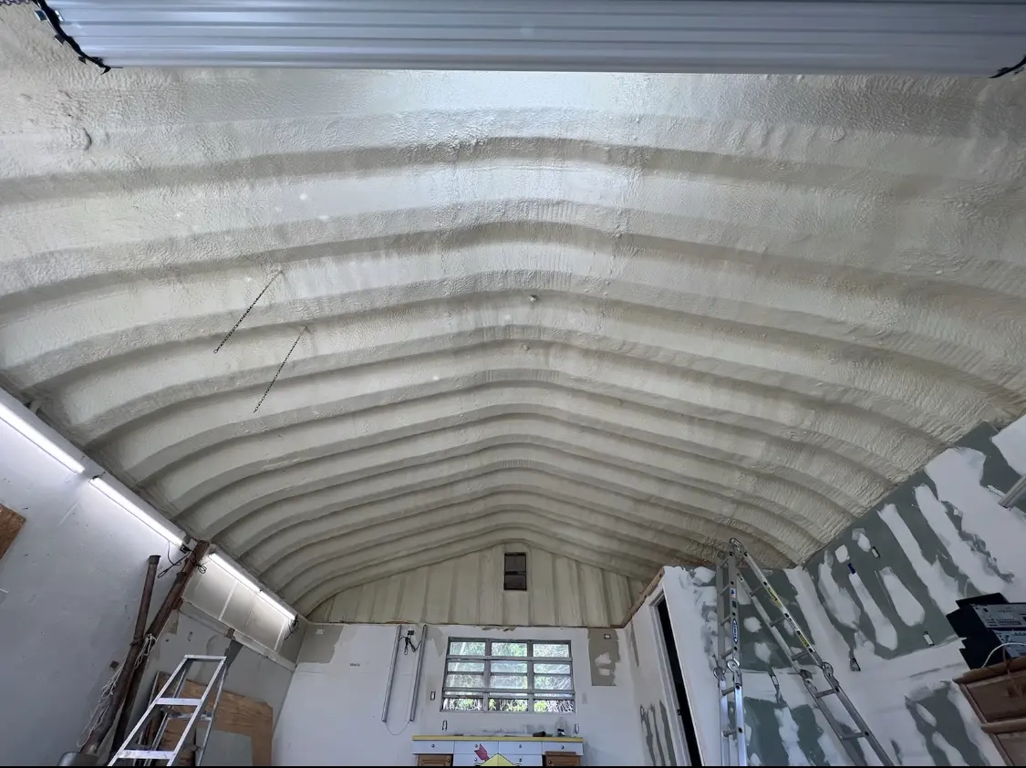 Spray polyurethane foam applied to the underside of a metal roof deck in Summit View
